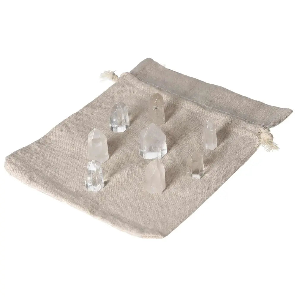 Mini Clear Quartz points on a cloth bag, ideal for amplifying energy and spiritual growth in crystal collections.