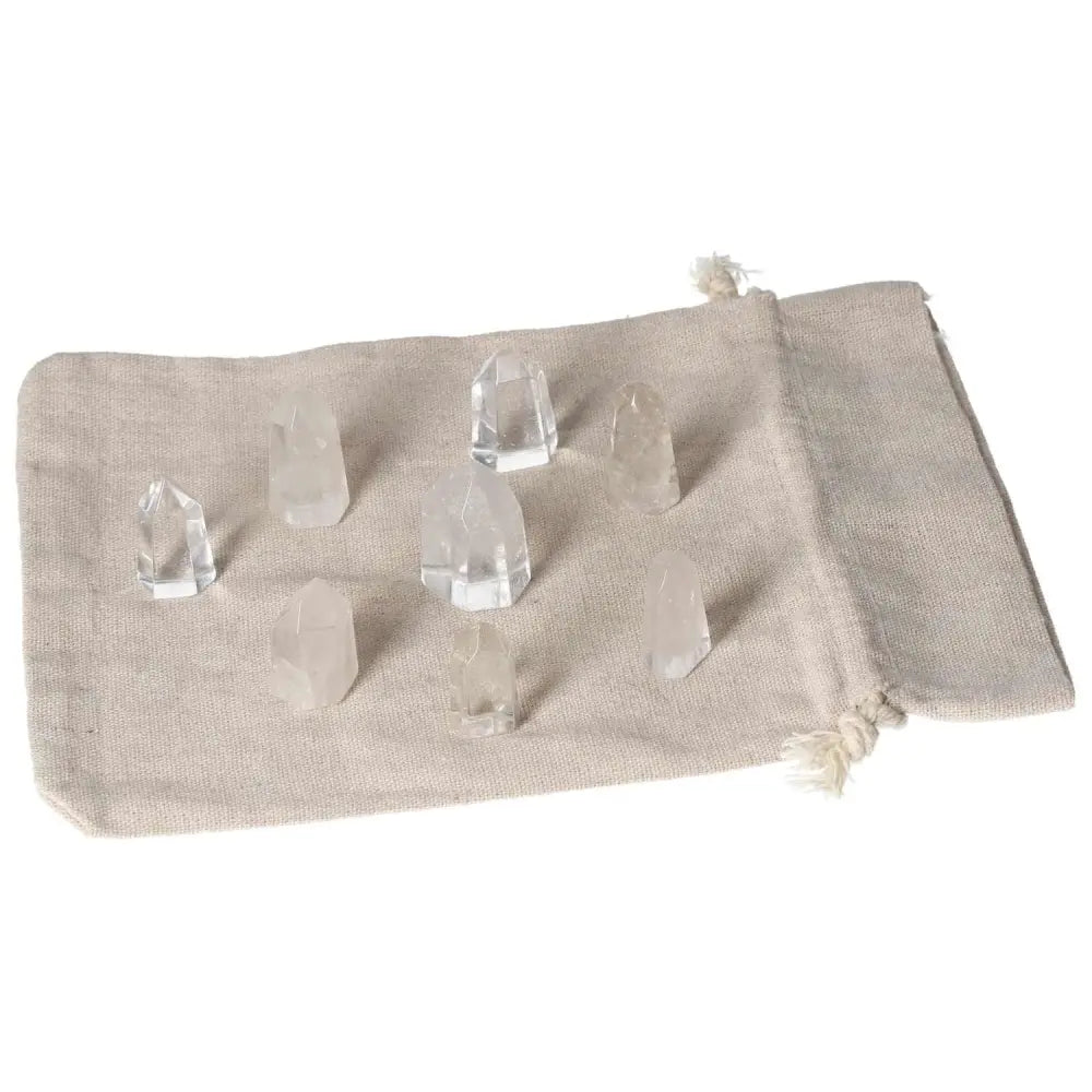 Mini Point Clear Quartz crystals on a fabric pouch, perfect for amplifying energy and spiritual growth. Enhance your collection today.