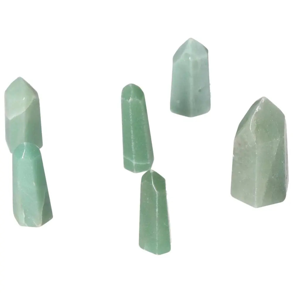 Mini Point Green Quartz crystals displayed on white background