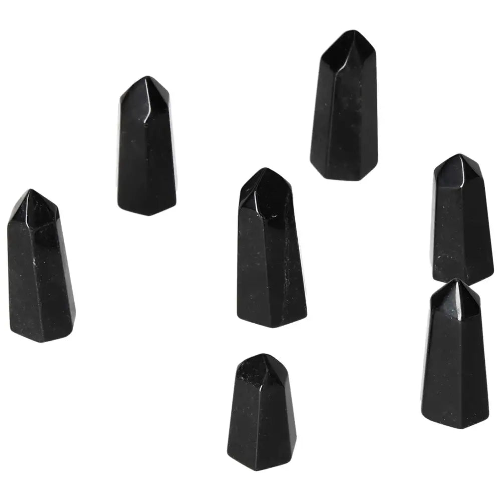 Collection of Mini Point Obsidian crystals, known for their powerful protective aura and ability to neutralize negative energy.