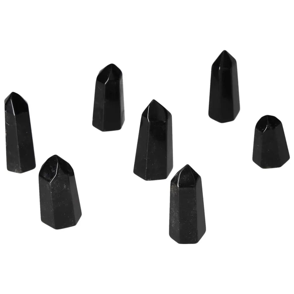Mini Point Obsidian stones arranged on a white background, showcasing their powerful protective auras and negative energy absorption qualities.