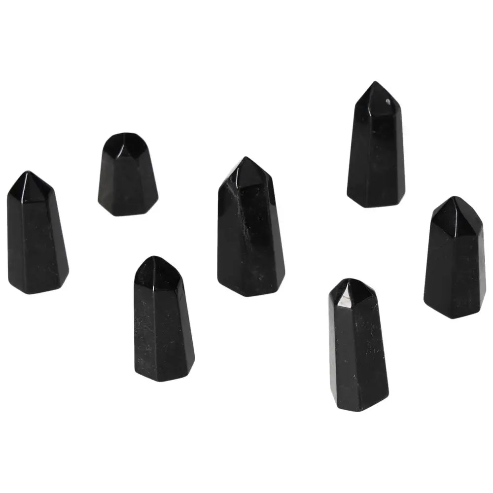 Mini Point Obsidian stones with powerful protective aura, absorbing and neutralizing negative energy, ideal for spiritual protection.