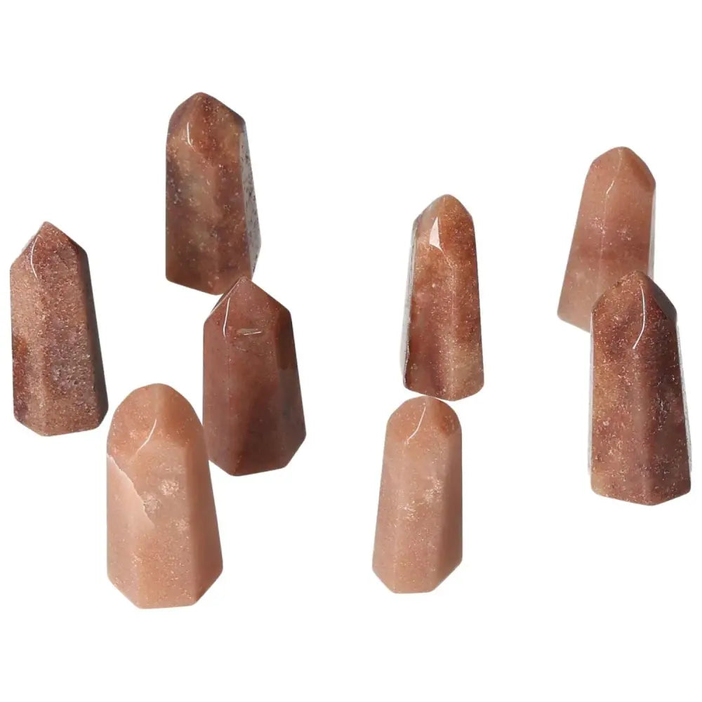 Mini Red Quartz Points showcasing fiery red tones for vitality and grounding energy, excellent for confidence and resilience.