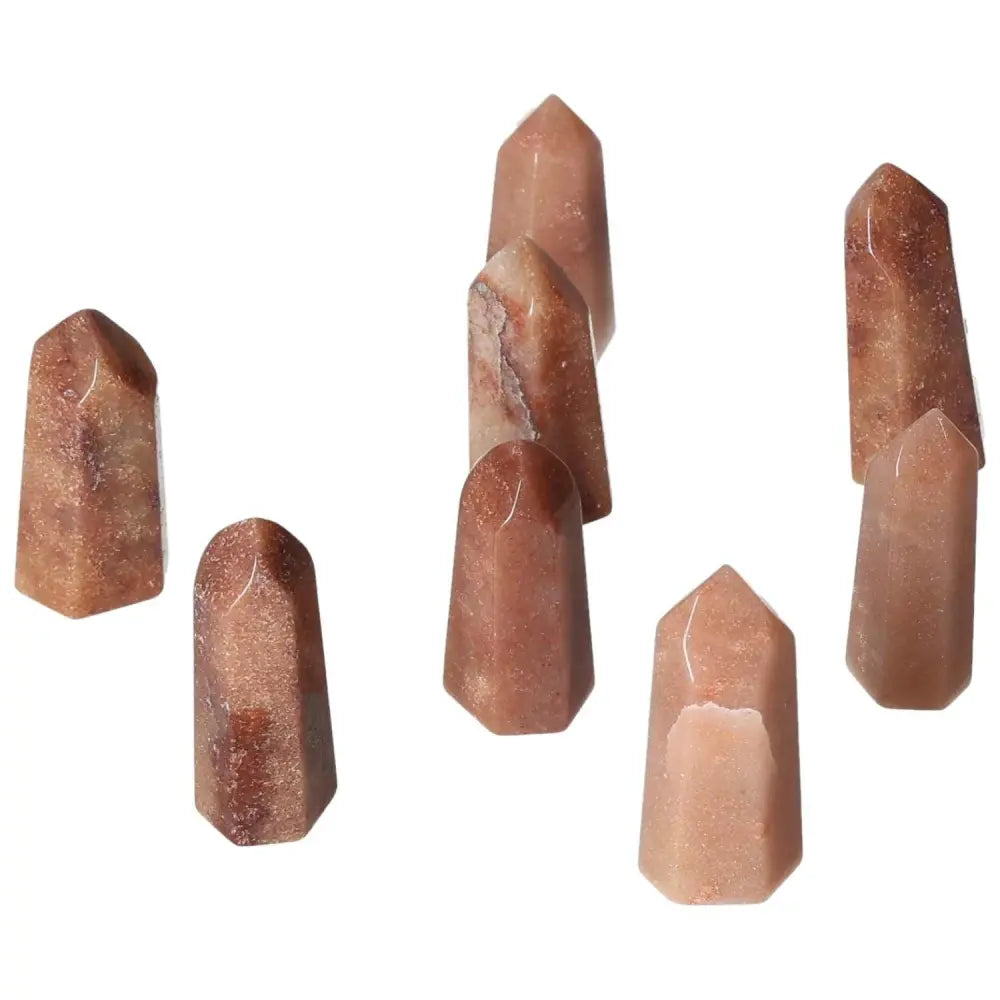 Mini Red Quartz Points with hematite inclusions showcasing rich red tones, enhance vitality, courage, grounded energy, and root activation.