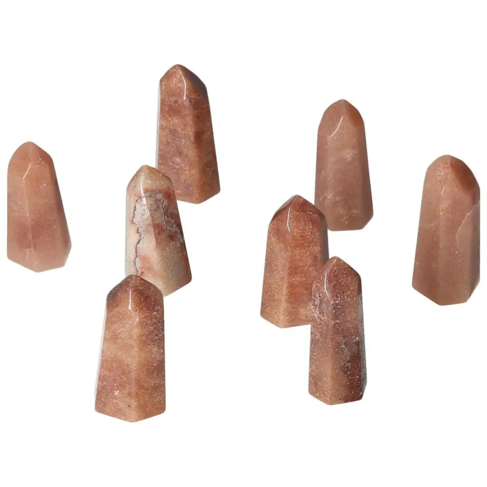 Group of Mini Red Quartz Points for vitality, courage, and grounding. Energy stones with natural hematite for motivation and resilience.