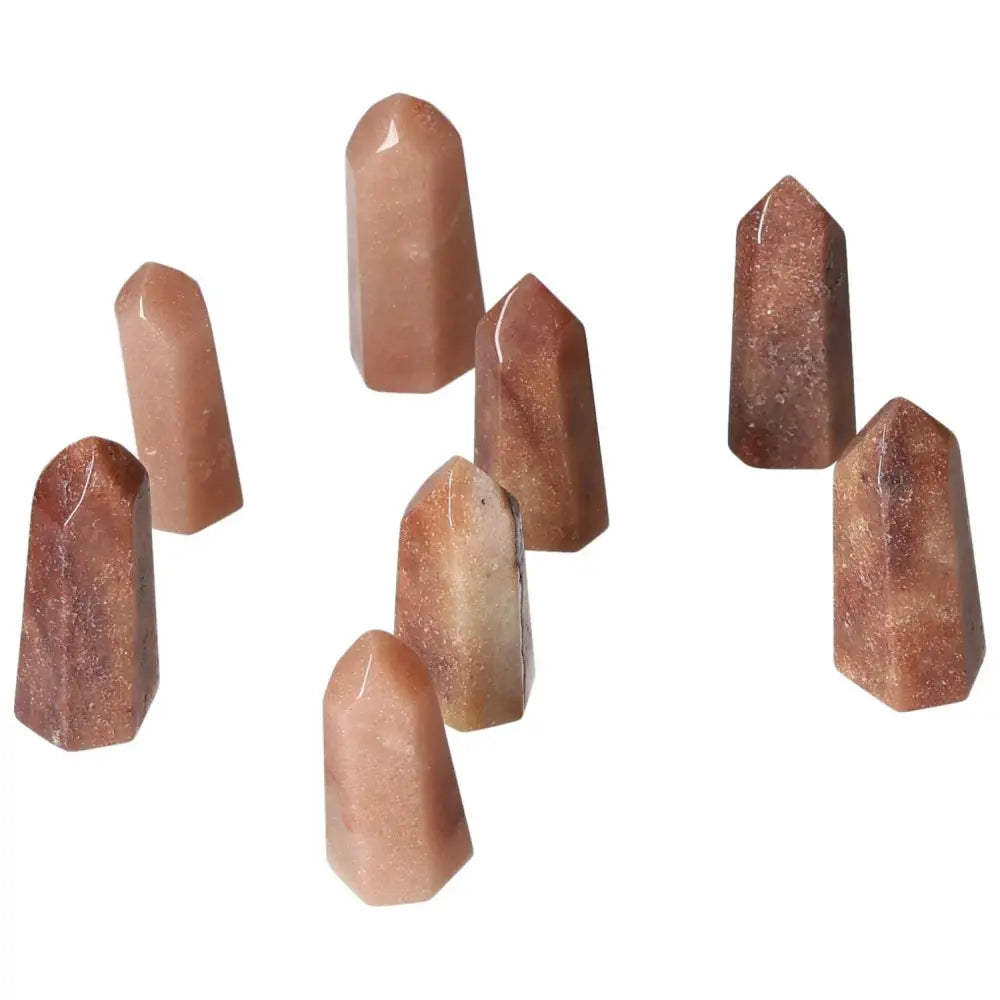 Mini Red Quartz Points with hematite inclusions, boosting energy, vitality, and confidence; perfect for grounding and root activation.