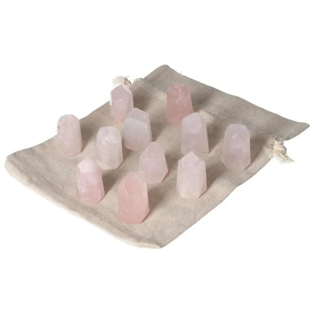 Mini Rose Quartz Points on cloth, promoting love and heart healing. Perfect for pocket use and supporting the heart chakra.