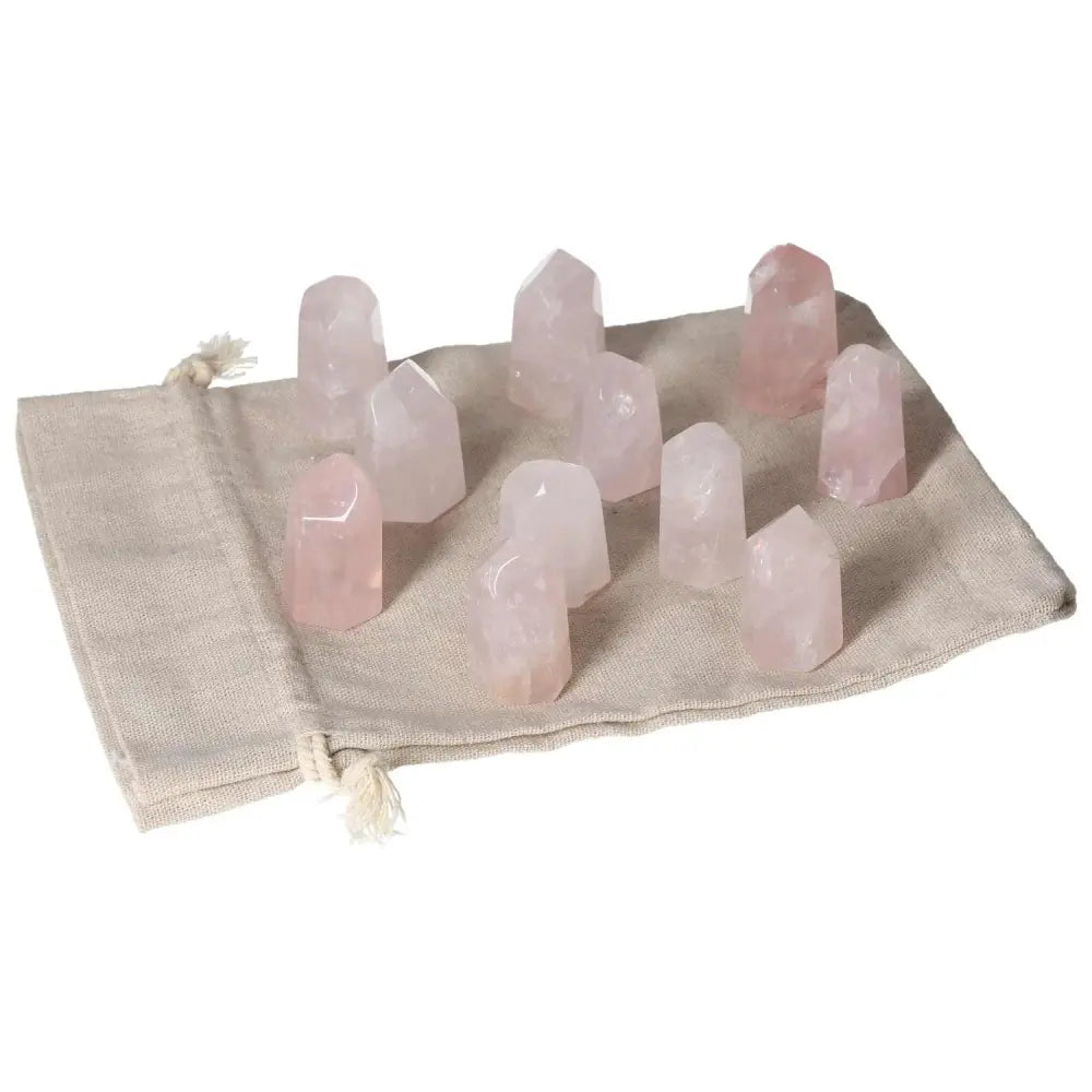 Mini Rose Quartz Points on a fabric pouch, promoting love, compassion, and heart healing, ideal for emotional balance and heart chakra support.