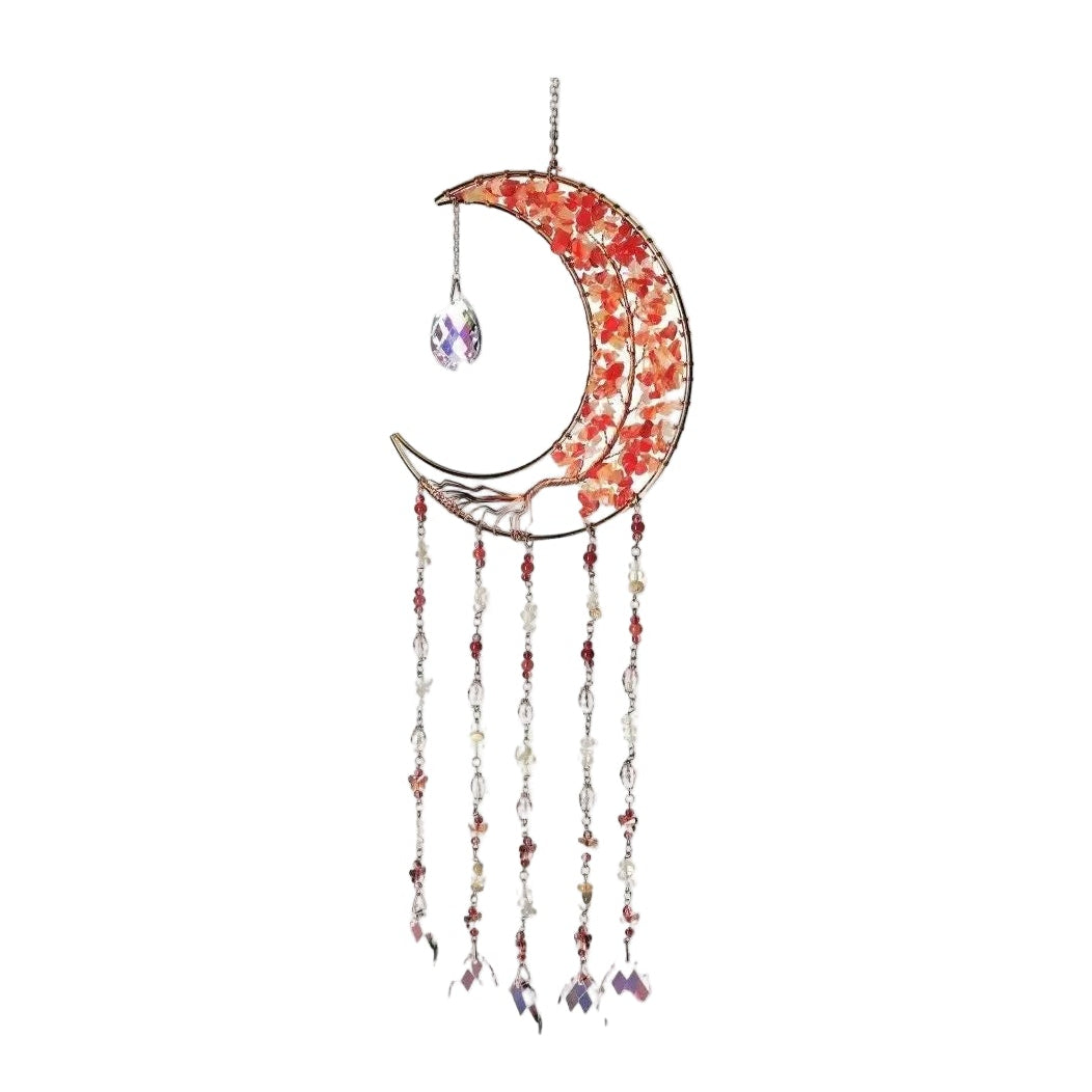 Moonlight Suncatcher with Red Agate crystal, crescent shape, and dangling chains, casting vibrant reflections in a bright space.