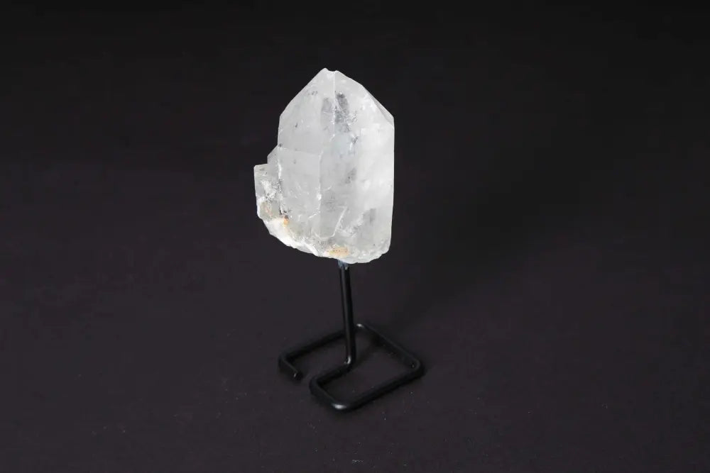 Natural Clear Quartz Point with Stand, ideal for energy amplification, meditation, and clarity enhancement, elegantly displayed on a modern stand.