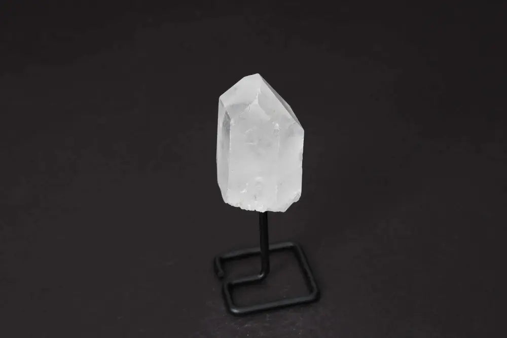 Clear Quartz Point on stand; amplifies energy and intention. Ideal for meditation, manifestation, and adding elegance to any space.