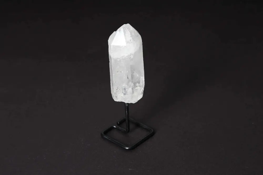 Natural Clear Quartz Point on Stand, ideal for energy amplification and meditation, elegant centerpiece for home decor.
