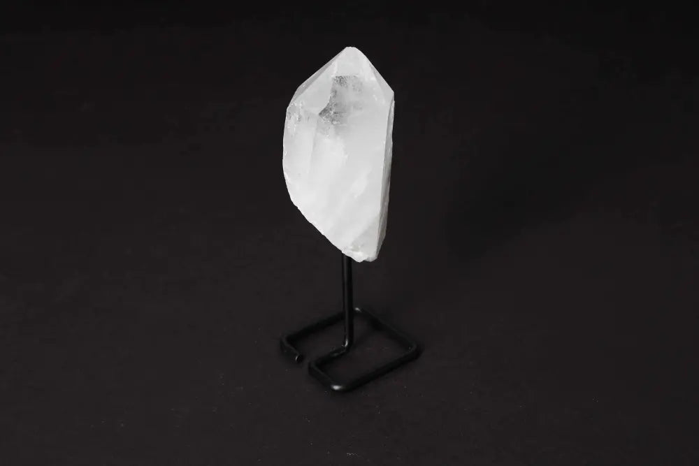 Natural Clear Quartz Point on modern stand, amplifying energy and intention. Ideal for meditation and clarity. Master Healer crystal.