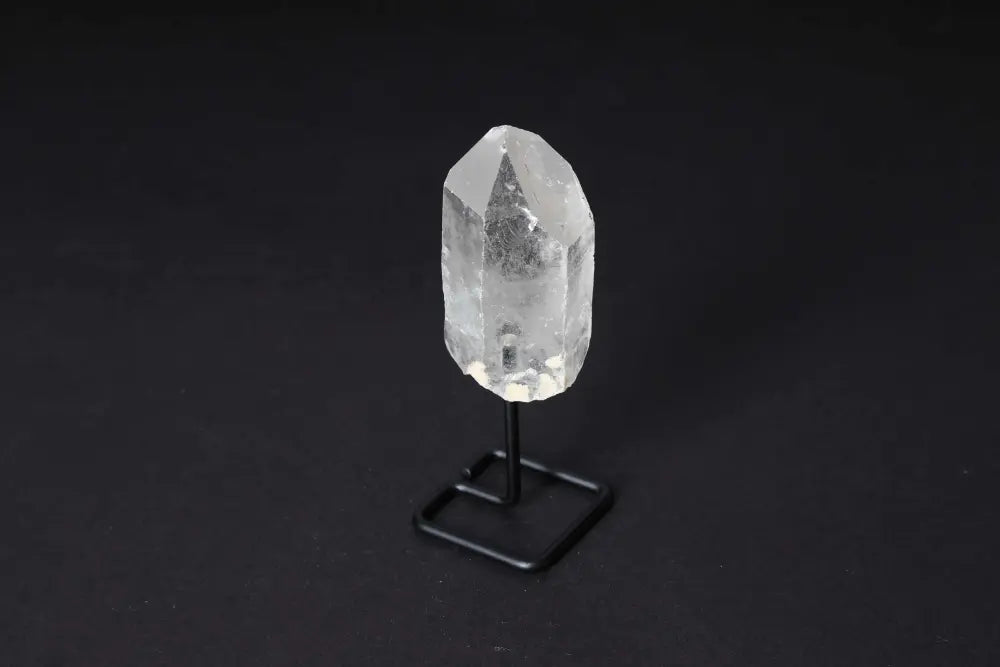 Natural Clear Quartz Point on modern stand for energy alignment and clarity. Ideal for meditation and manifestation.