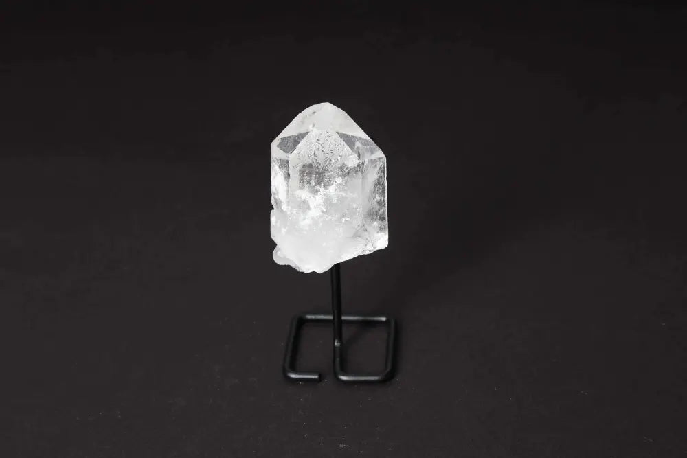 Natural Clear Quartz Point with Stand, ideal for amplifying energy and clarity, perfect for meditation and modern decor.