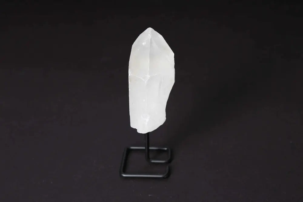 Natural Clear Quartz Point on Stand for energy amplification and meditation, elegant display for home or office decor.