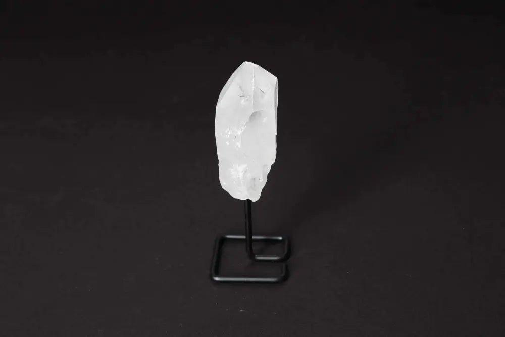 Clear Quartz Point on Stand, a Master Healer crystal for energy amplification, focus, and clarity, ideal for meditation and manifestation.