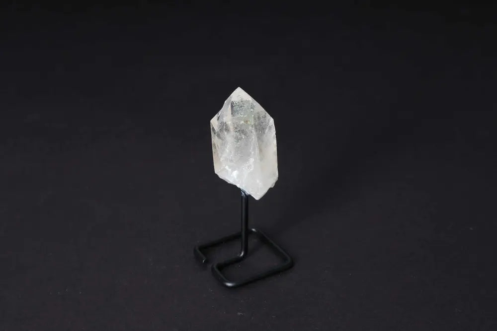 Clear Quartz Point on Stand - Master Healer for energy amplification, meditation, and clarity. Elegant decor piece.