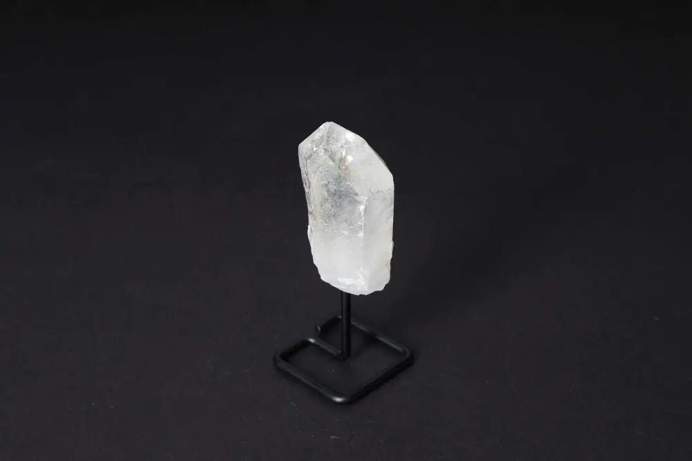 Natural Clear Quartz Point with stand, amplifying and illuminating energy; perfect for meditation and manifestation.