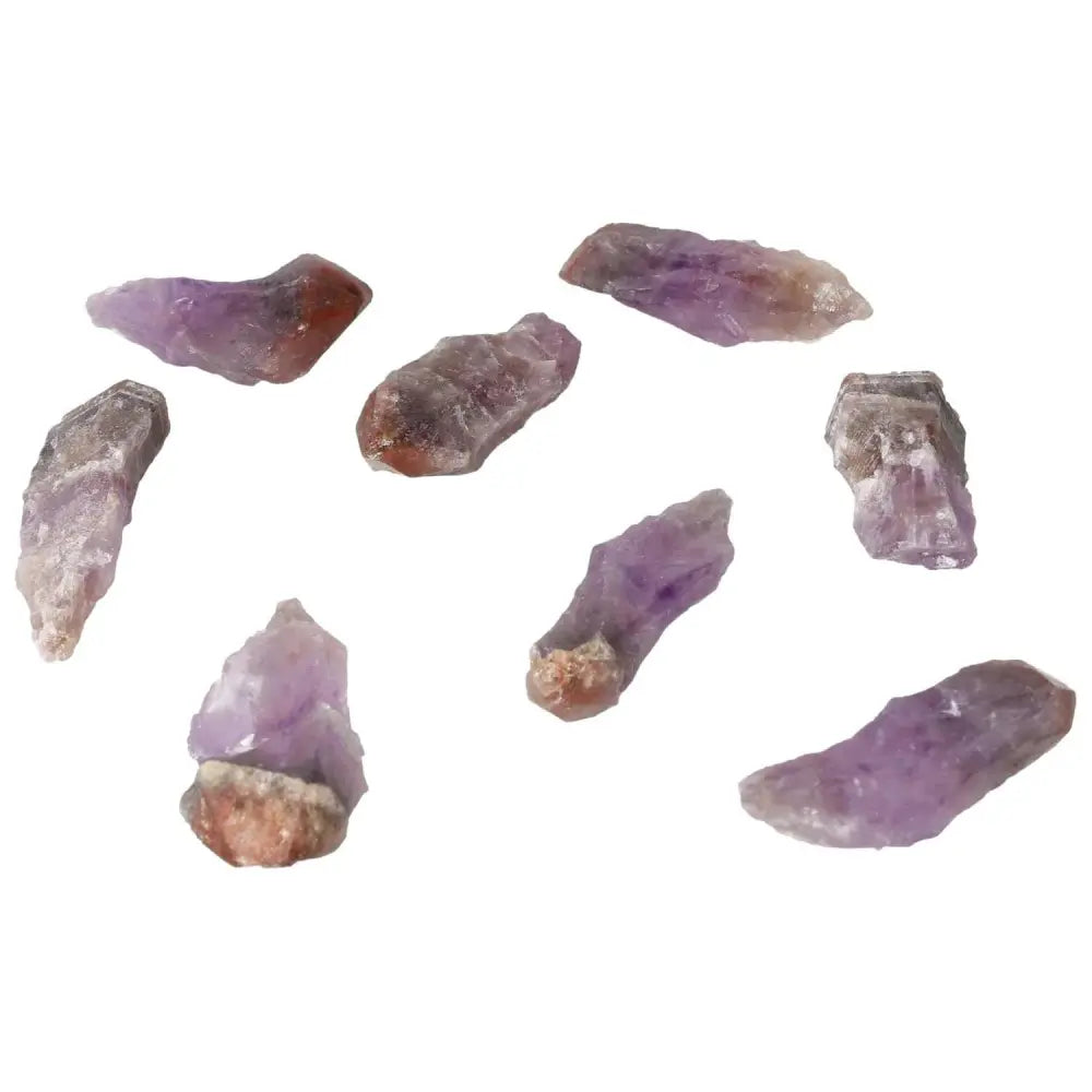 Natural Point Amethyst stones from Sylvia Crystals, offering tranquility and positive energy for stress relief and concentration enhancement.