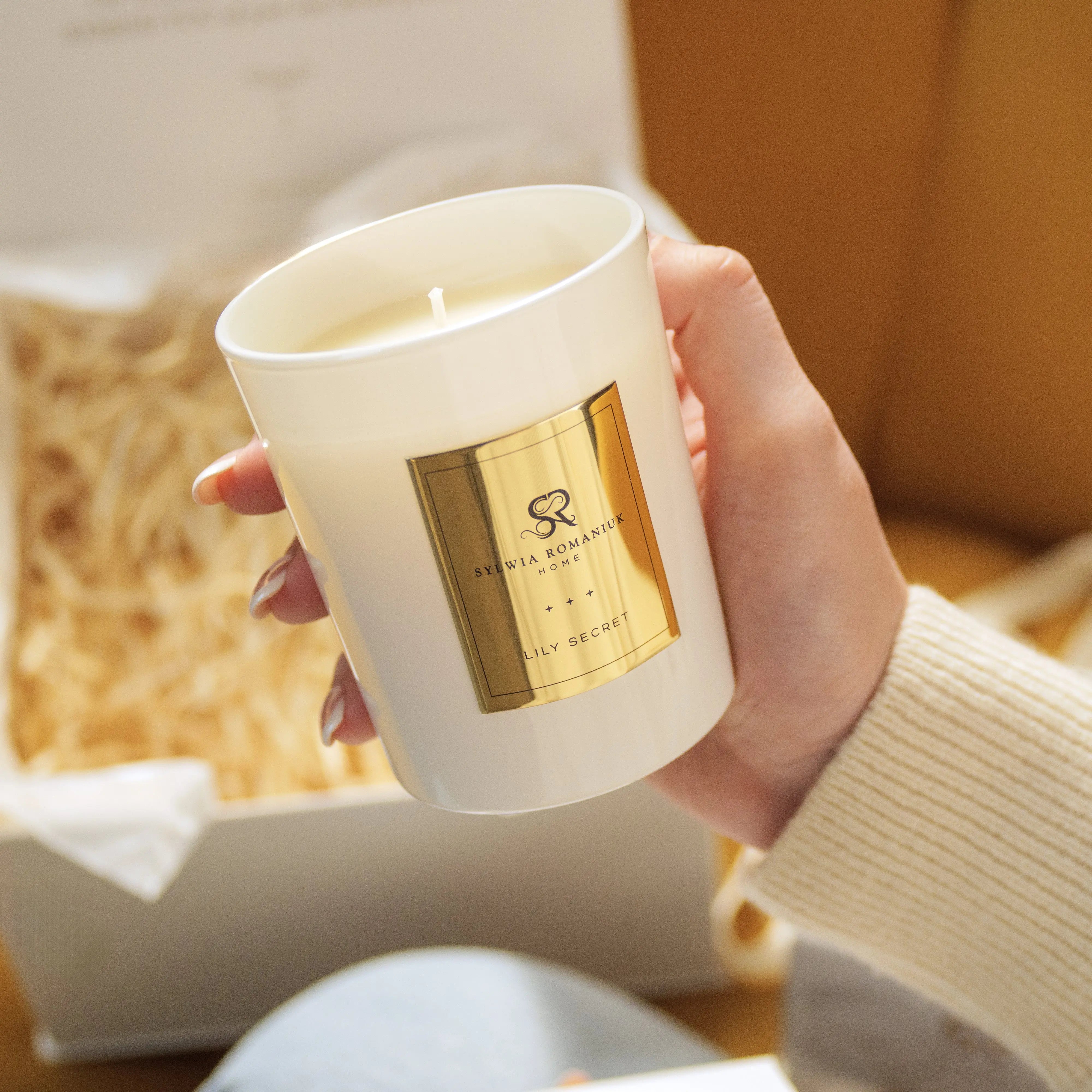 Sylwia Romaniuk HOME luxury candle in an elegant gift box, perfect for elevating home or gifting experiences.