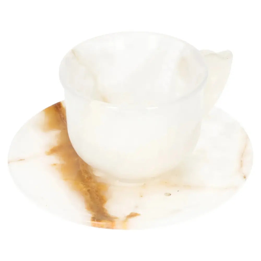 Onyx coffee cup and plate set with unique off-white tones, showcasing elegant craftsmanship and natural beauty.