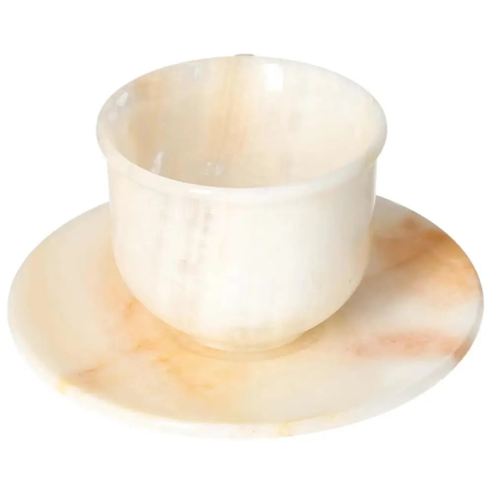 Exquisite off-white onyx coffee cup and plate set, showcasing natural variations in tone and pattern for an elegant coffee ritual.