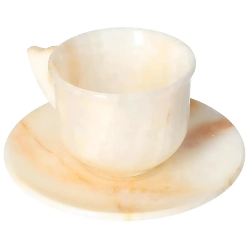 Off-white onyx coffee cup and plate set with unique patterns, showcasing elegance and natural beauty, perfect for enhancing any space's aesthetic.