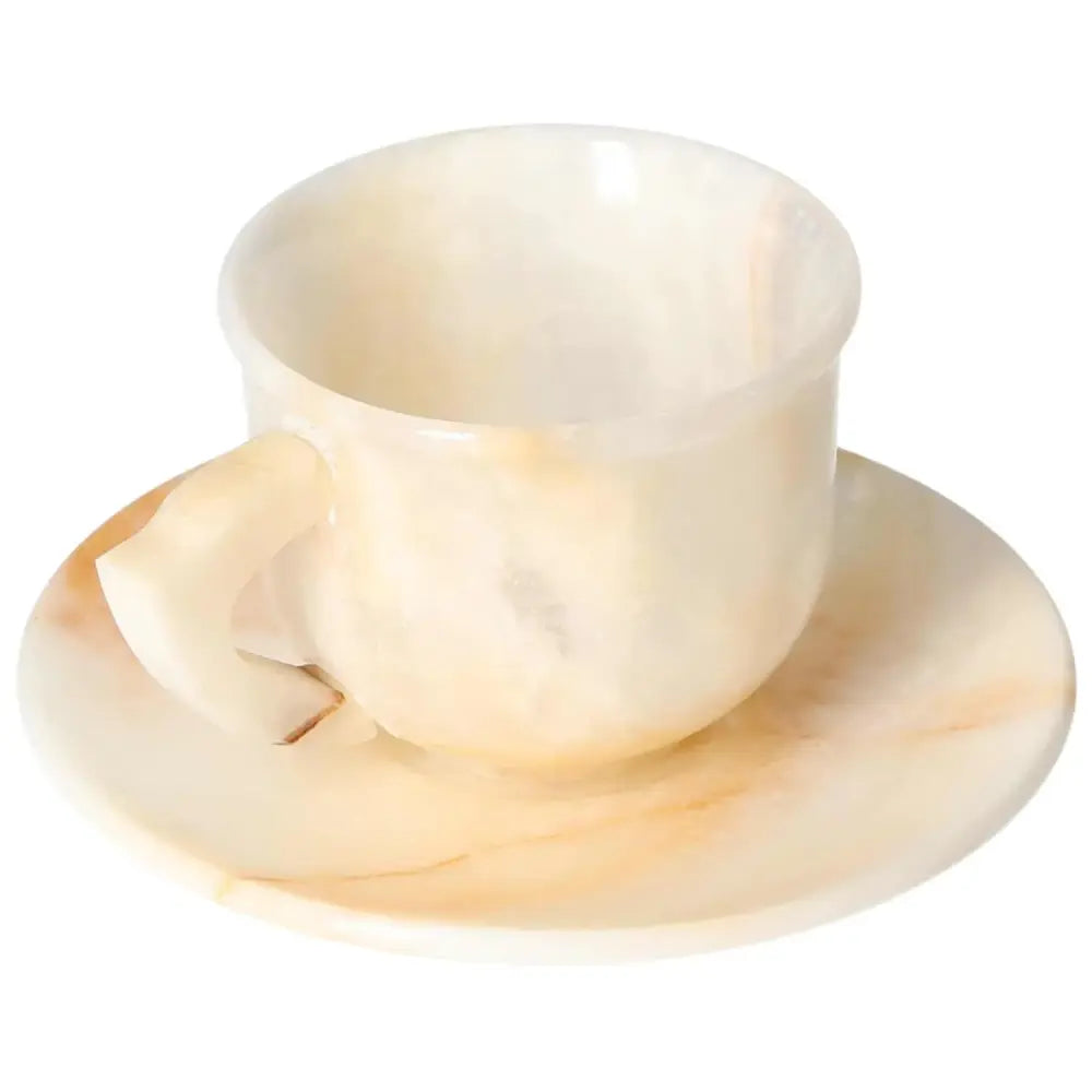 Exquisite off-white onyx coffee cup and plate set, showcasing unique patterns and smooth, polished surfaces for an elegant coffee experience.
