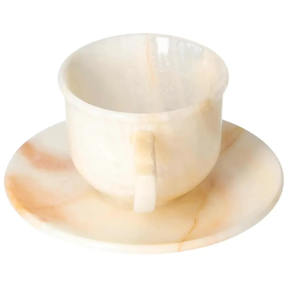 Exquisite off-white onyx coffee cup and plate set, displaying unique natural patterns and a polished, sophisticated finish.