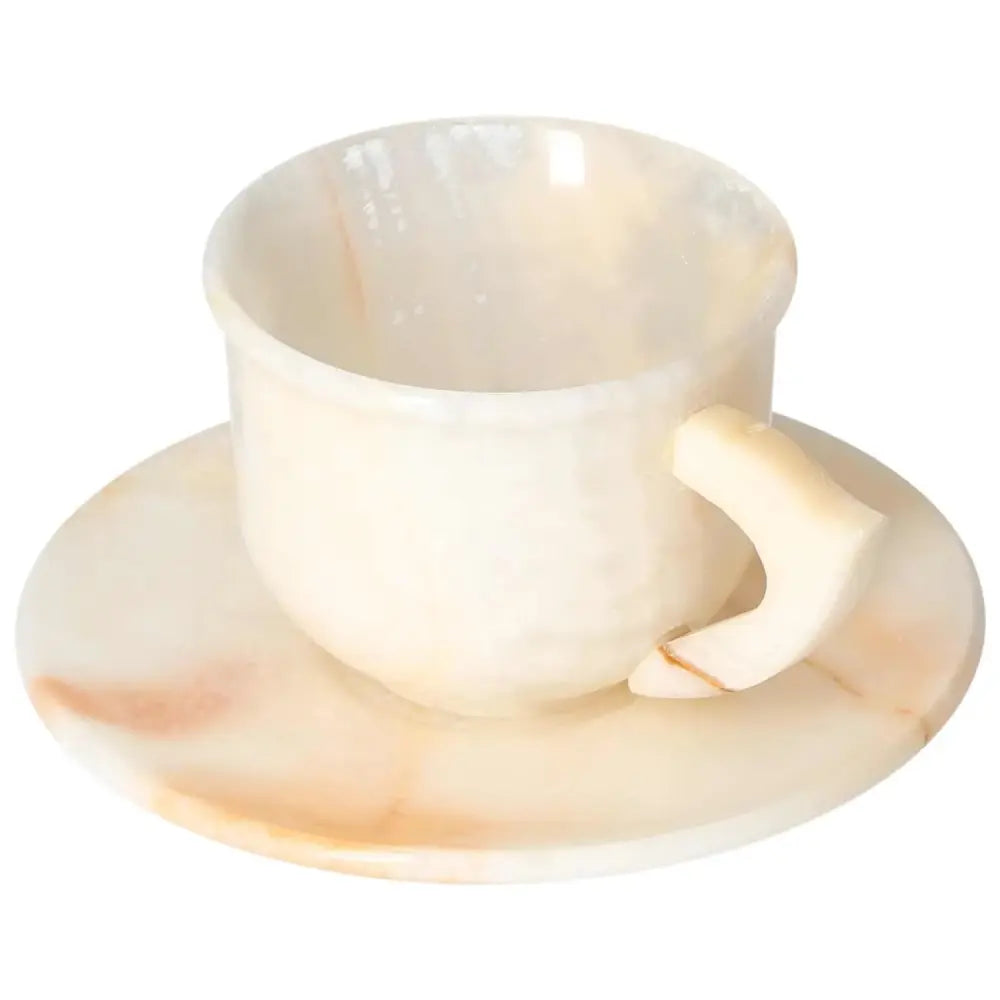 Elegant off-white onyx coffee cup and plate set with unique patterns, crafted for a sophisticated coffee experience.