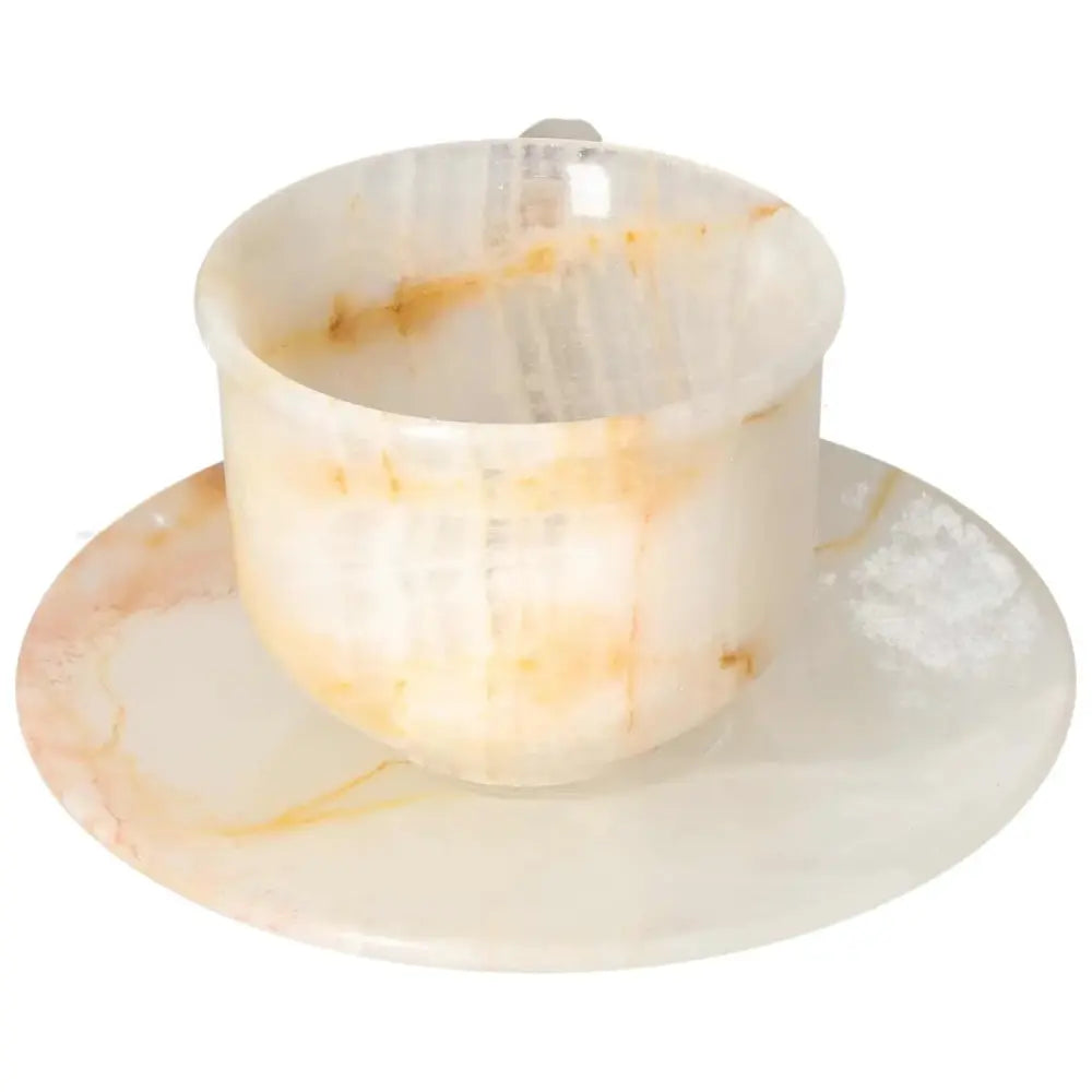 Elegant onyx coffee cup and plate set made from premium off-white onyx, showcasing unique patterns and a polished finish for a luxurious touch.