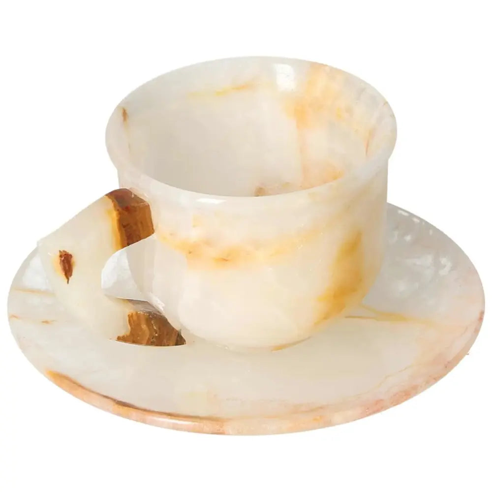 Elegant off-white onyx coffee cup with plate, showcasing unique patterns and polished surface for a luxurious coffee experience.