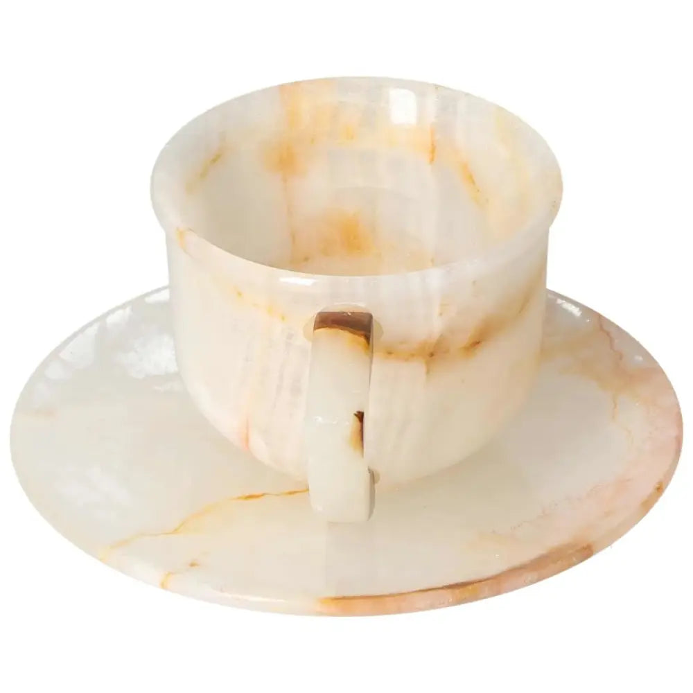 Exquisite off-white onyx coffee cup with plate, showcasing unique natural patterns and polished finish, enhancing any coffee ritual.