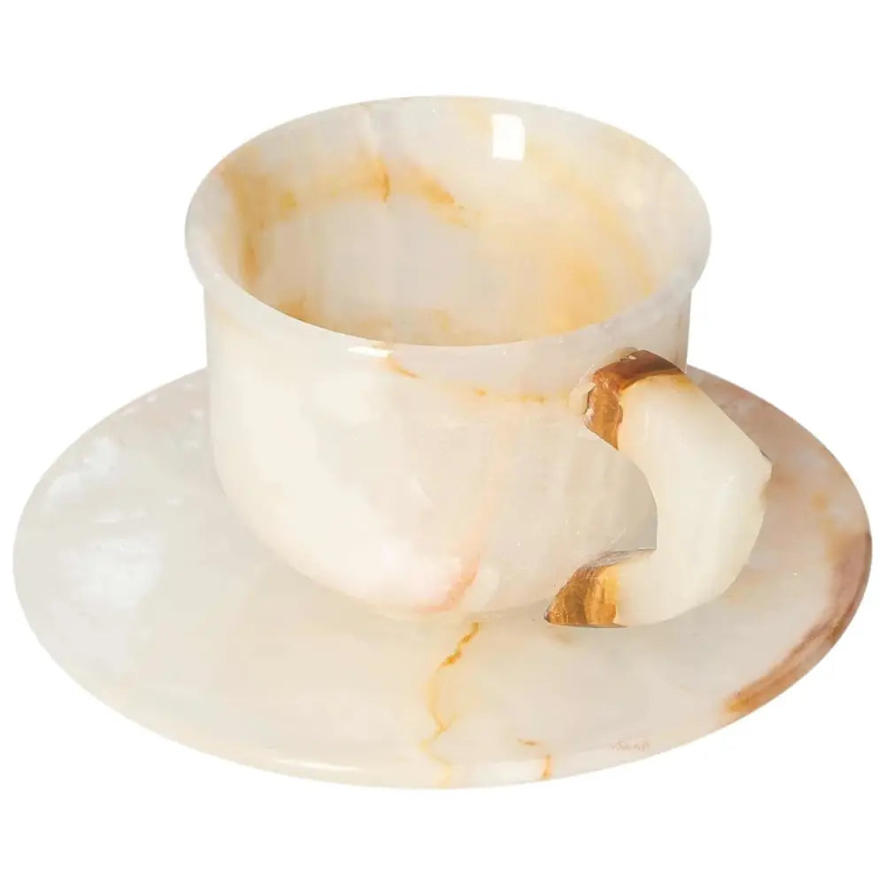 Exquisite onyx coffee cup with plate, showcasing unique off-white tones and patterns, perfect for elevating coffee rituals.