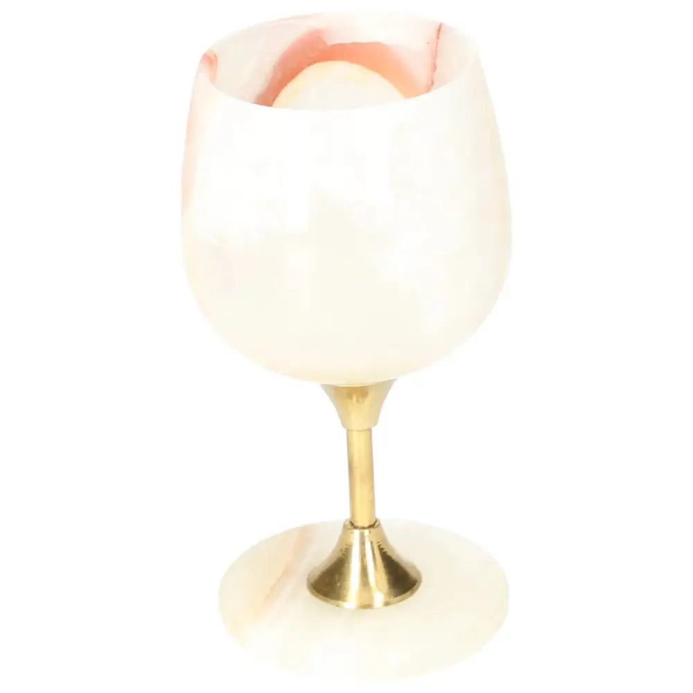 Elegant onyx wine glass with a unique off-white color and veining patterns, featuring a smooth polished surface and gold stem.