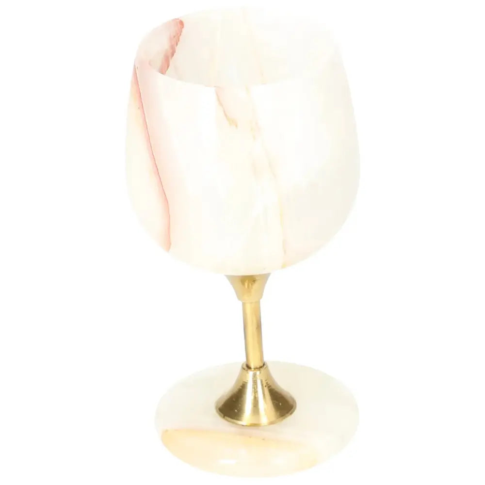 Elegant off-white onyx wine glass with unique veining and a polished surface, set on a brass stem, perfect for sophisticated occasions.