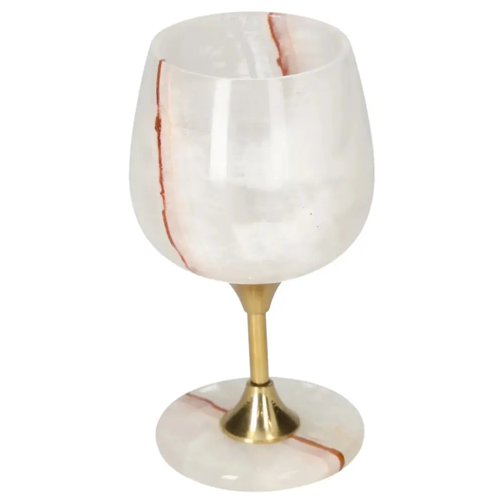 Exquisite onyx wine glass with unique veining and a polished gold stem, perfect for elegant dining and fine drinking experiences.