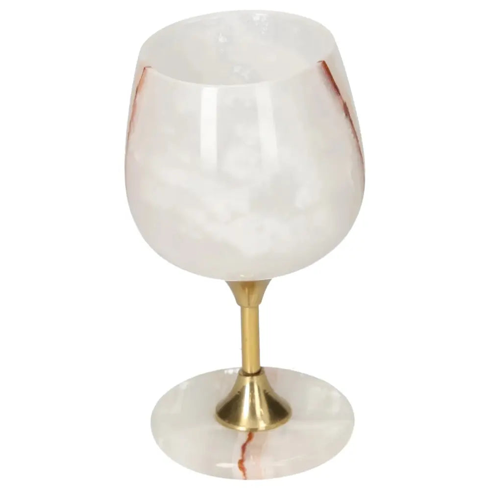 Elegant onyx wine glass with unique veining, featuring a polished off-white surface and gold stem, perfect for upscale dining.