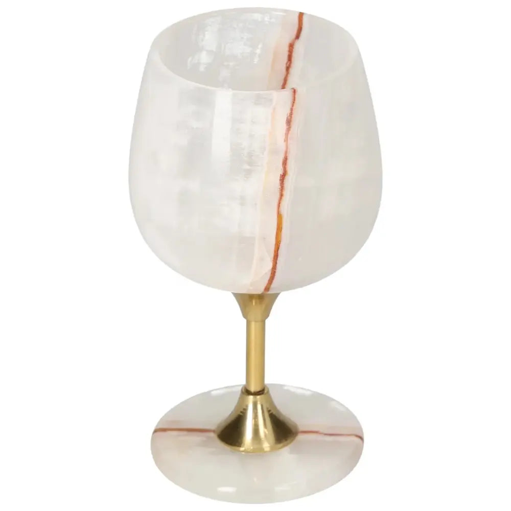 Elegant off-white onyx wine glass with gold stem, showcasing unique color variations and veining for a sophisticated drinking experience.