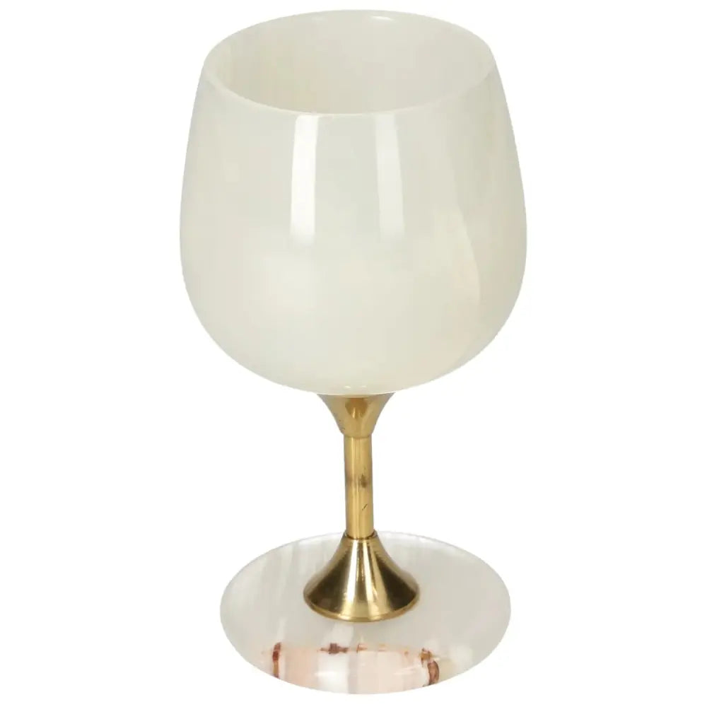 Elegant onyx wine glass with polished surface and gold stem, showcasing unique off-white veining for a sophisticated dining experience.