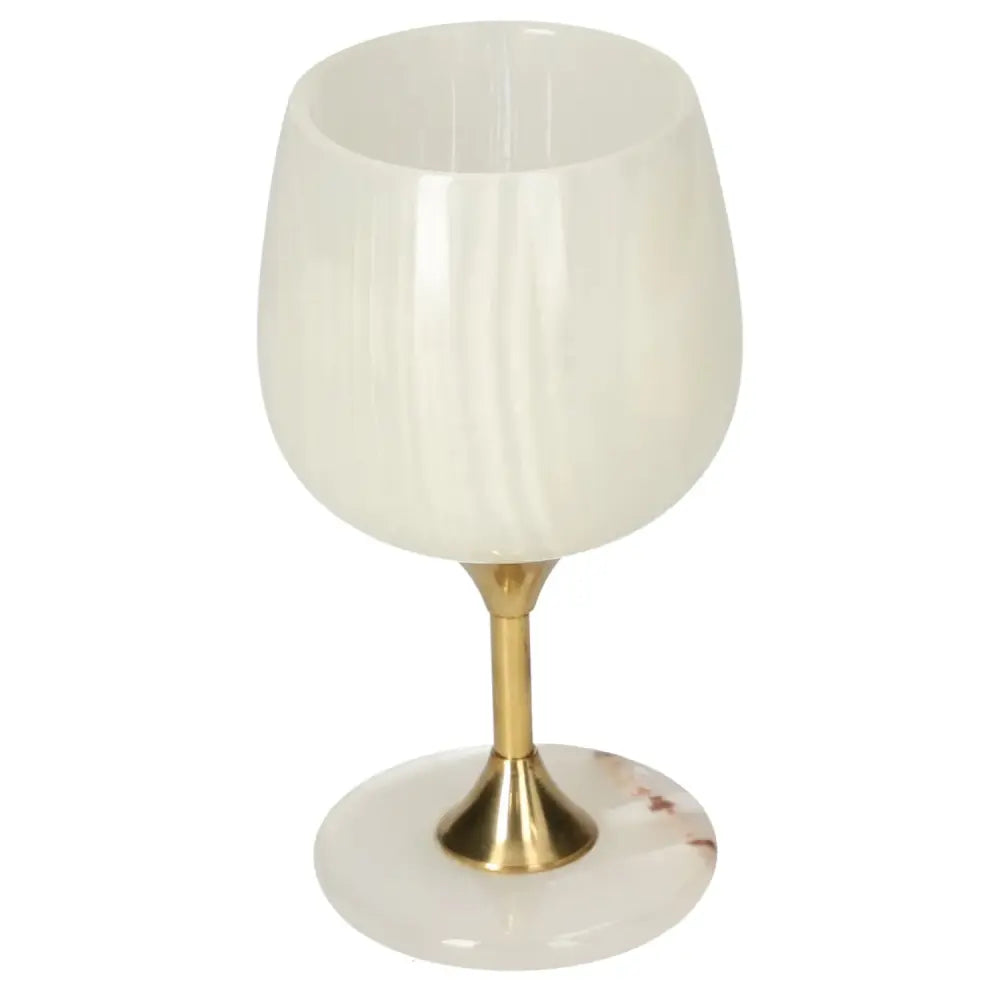 Exquisite onyx wine glass with a brass stem, showcasing unique off-white variations and polished elegance for sophisticated drinking.