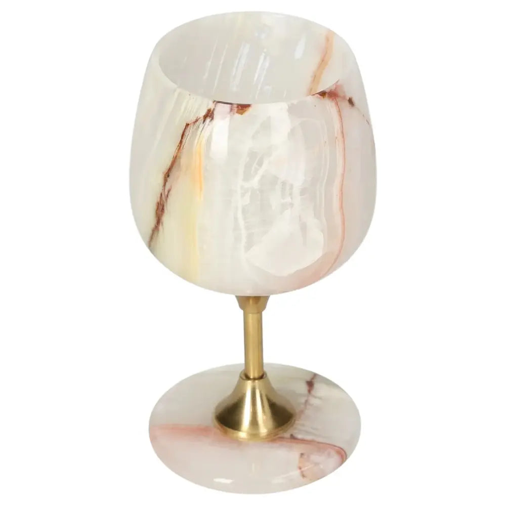 Elegant off-white onyx wine glass with golden stem, showcasing unique veining and polished finish, perfect for sophisticated decor.