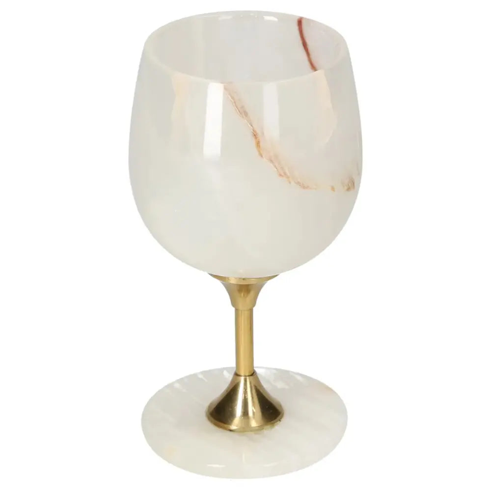 Exquisite off-white onyx wine glass with unique veining and gold stem, showcasing elegance and sophistication for fine dining.