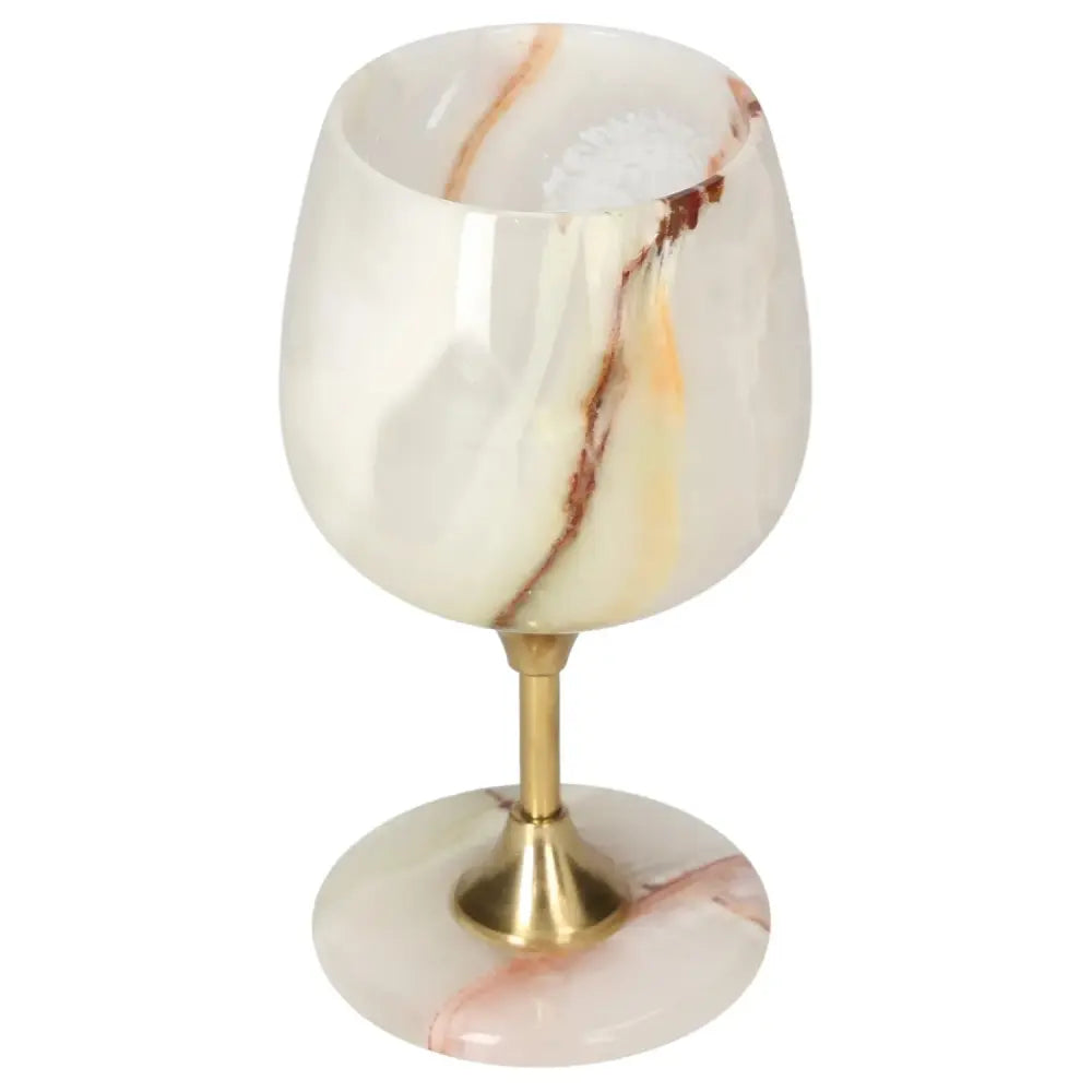 Exquisite onyx wine glass with unique veining and polished finish, blending elegance and natural allure for sophisticated occasions.