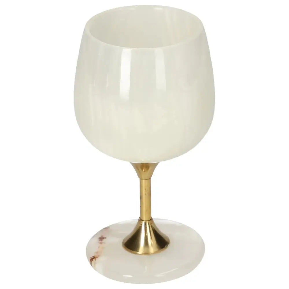 Elegant off-white onyx wine glass with natural veining and polished gold stem, perfect for sophisticated occasions.