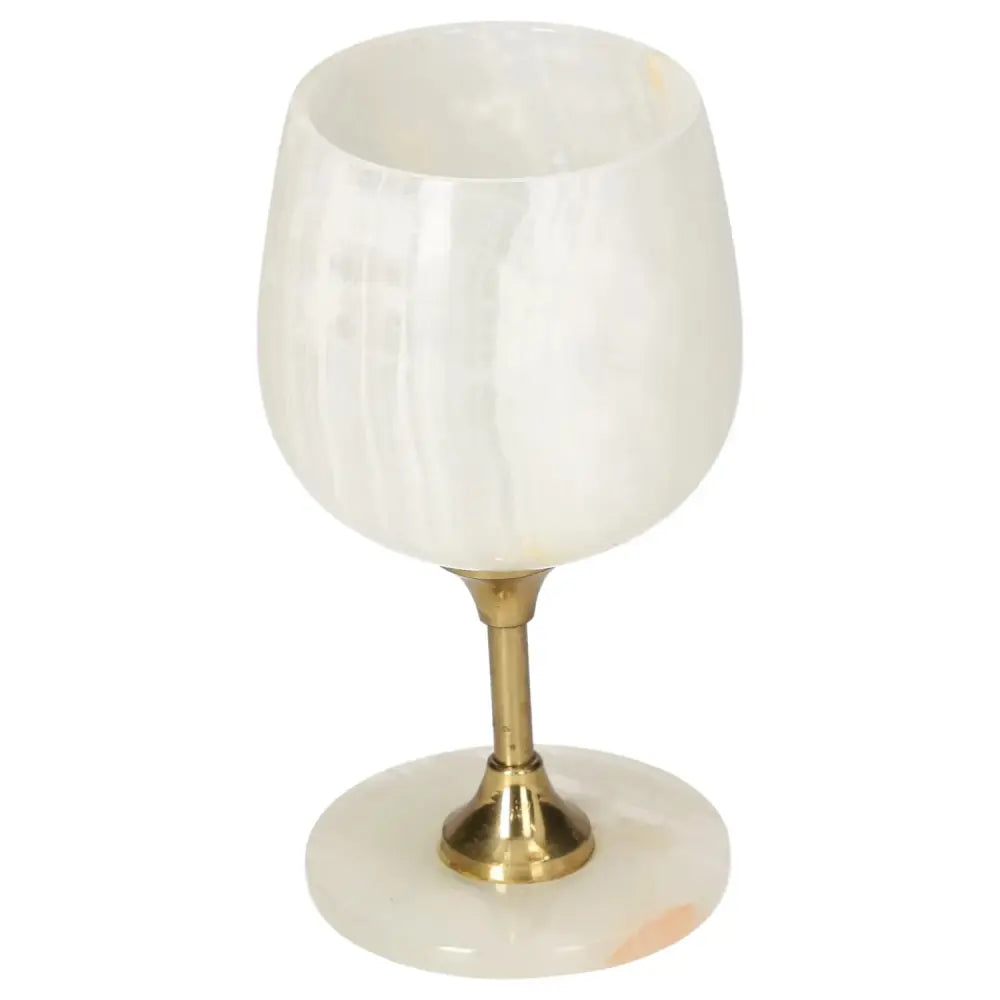 Exquisite onyx wine glass with off-white veining and polished surface, featuring a golden stem, blending elegance and natural allure.