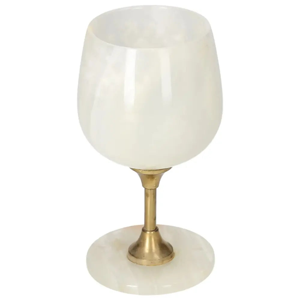 Elegant onyx wine glass with off-white veining and a polished brass stem, showcasing sophisticated craftsmanship and natural beauty.