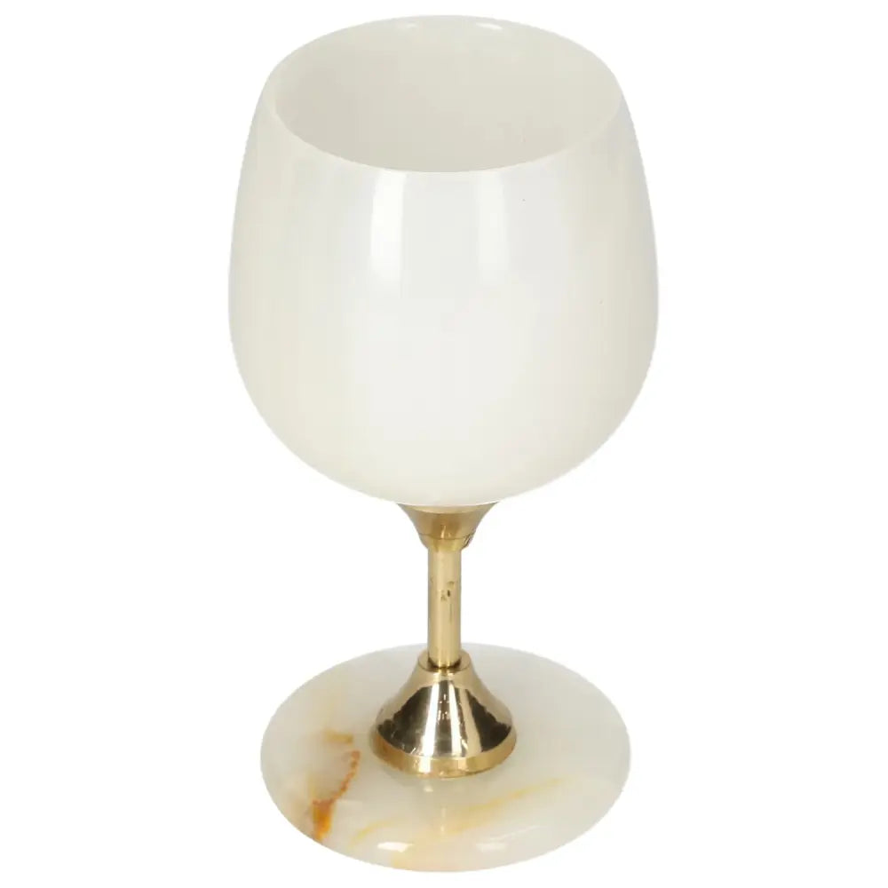Exquisite onyx wine glass with unique veining, featuring a smooth polished surface and elegant golden stem.