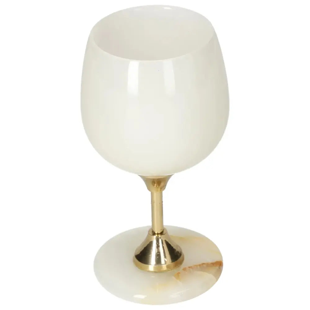 Elegant onyx wine glass with off-white hues and veining, featuring a polished surface and gold-toned stem for sophisticated occasions.